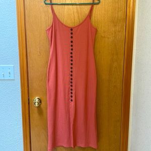 Mid length ribbed dress with front slit and decorative buttons